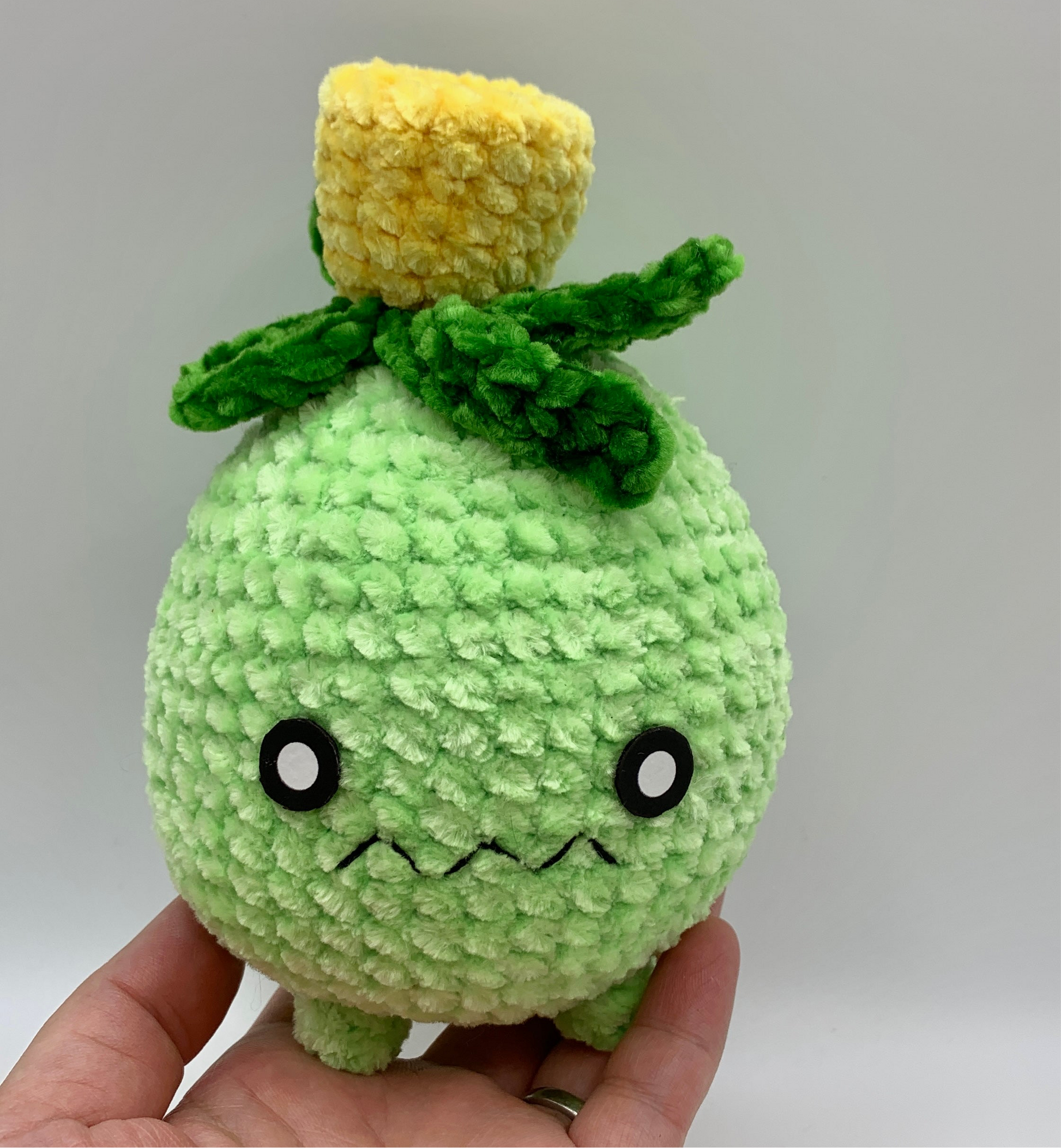 Soft, squishy Smoliv plush made using the free crochet pattern