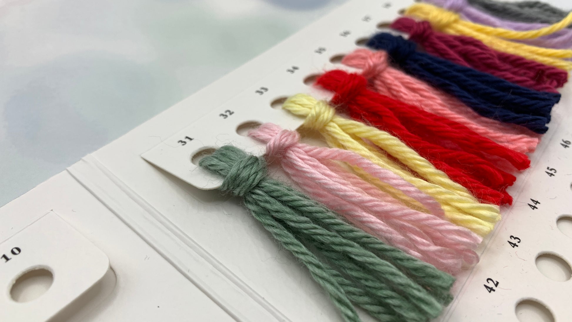 yarn sample attached to swatch card for crochet reference