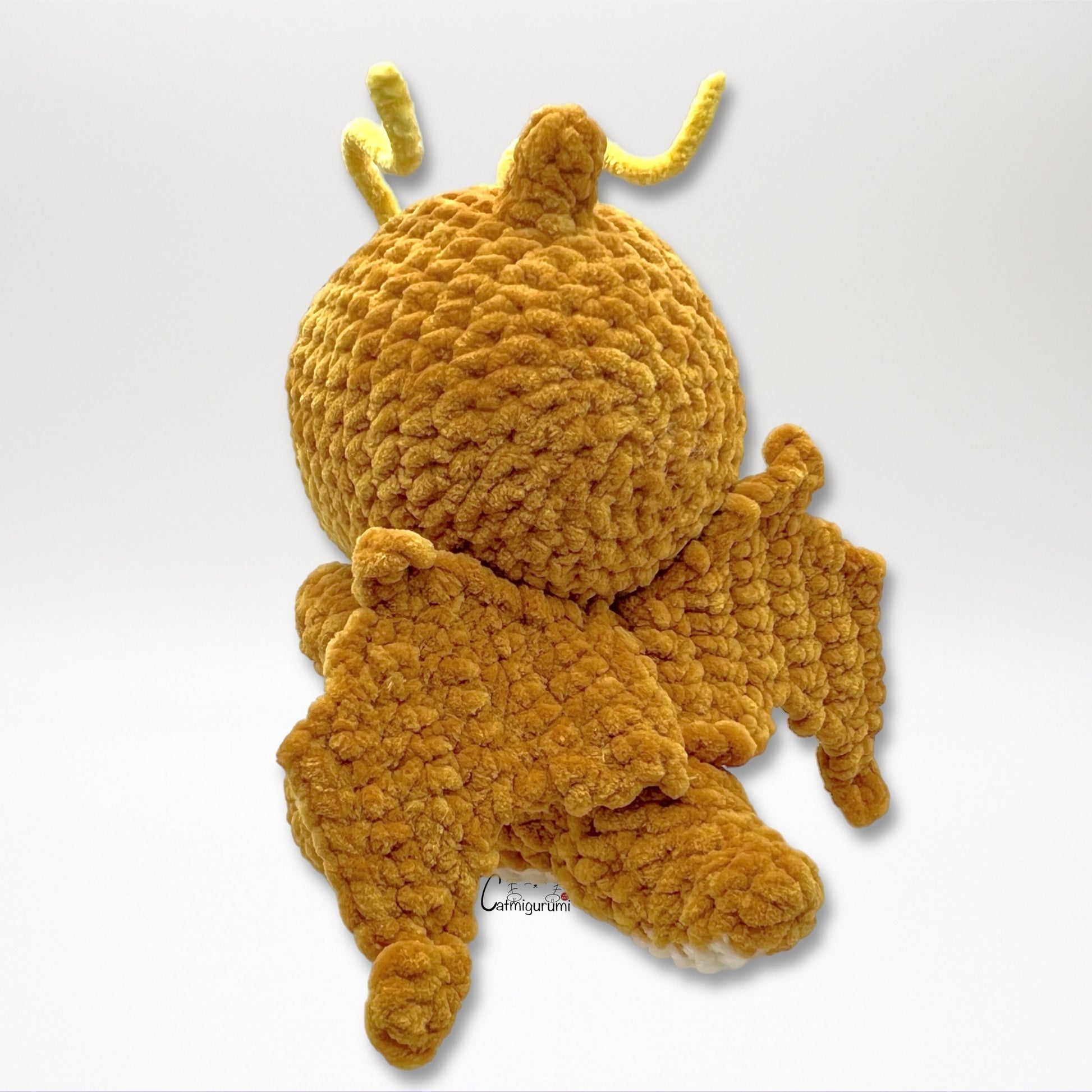 Back view of flying yellow dragon amigurumi crochet plush pattern result